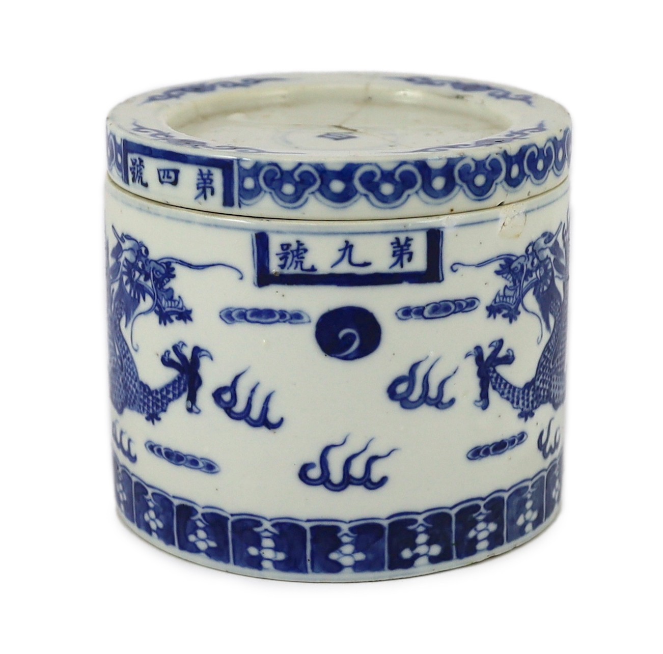 An unusual Chinese blue and white 'dragon' box and cover, 19th century, 10.5cm high, lid repaired, rim chip